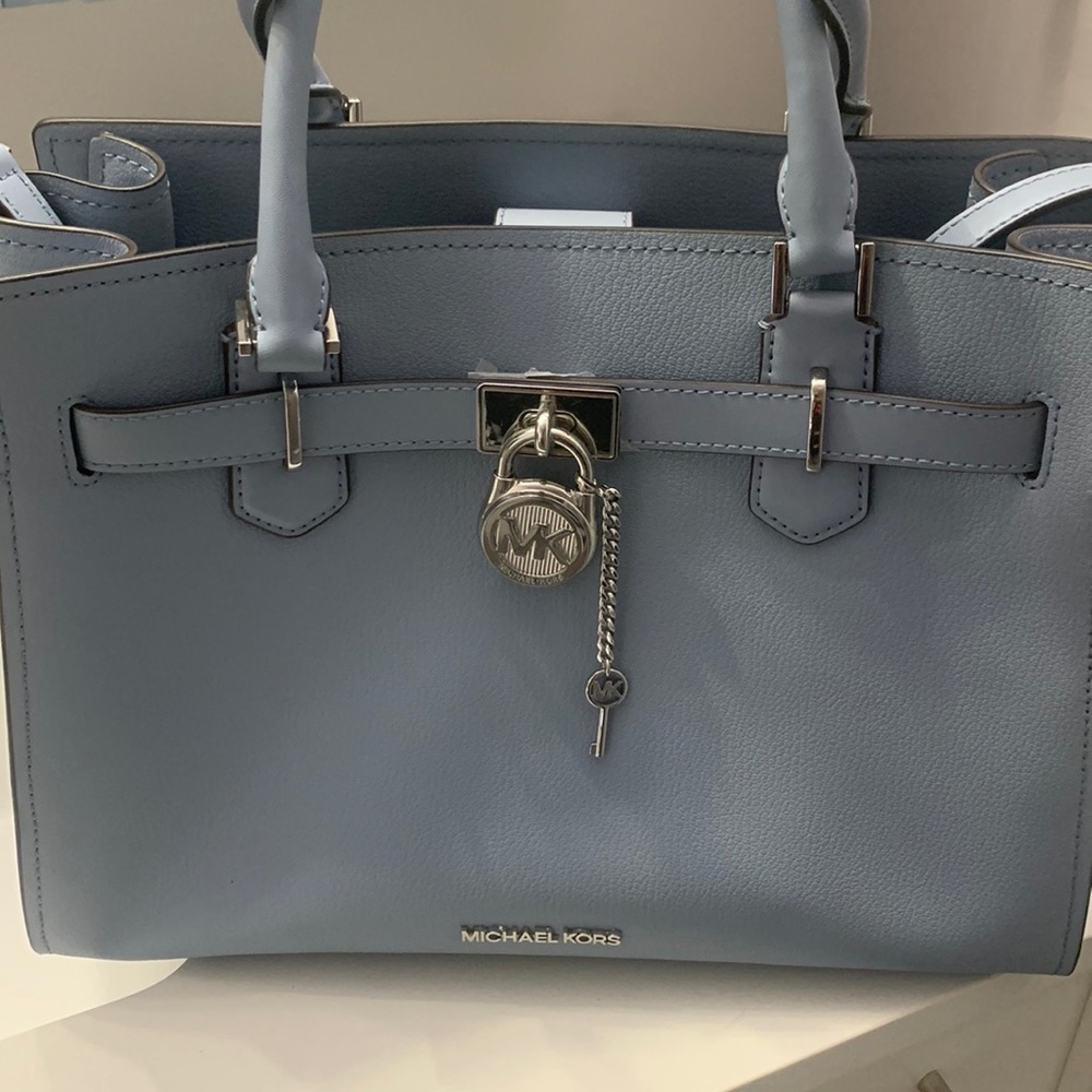 Gently used Pale Blue MK Hamilton purse.